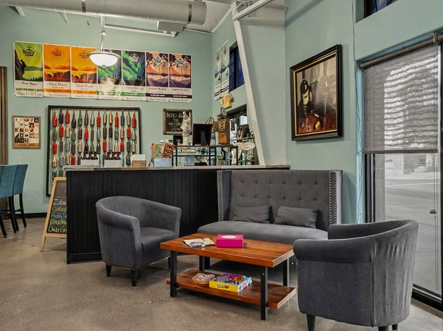 Lounge seating beneath a wall of First Place awards