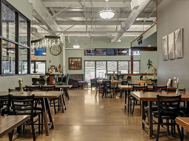 Dining room with tables and front windows