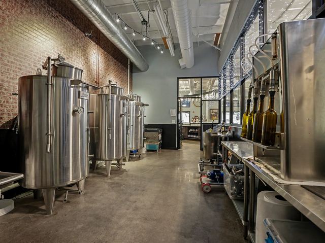 Stainless fermentation tanks in the production room